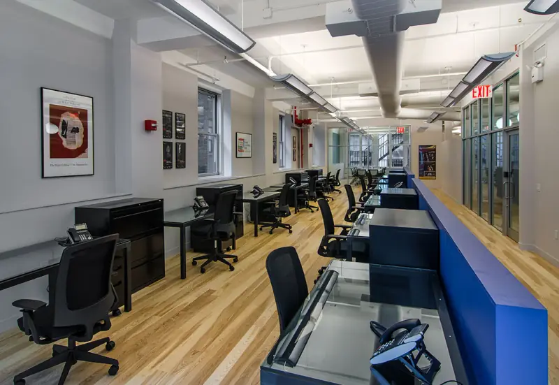 Chamber Music America office with blue walls and wood floors