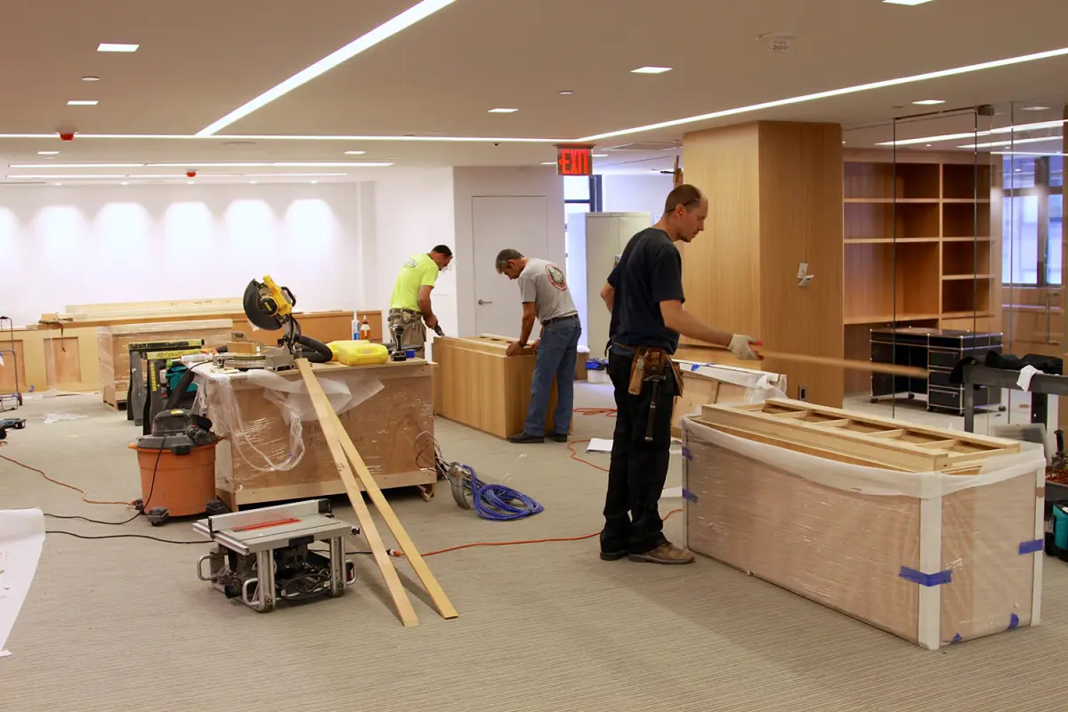 E.J. York carpenters building custom millwork on site