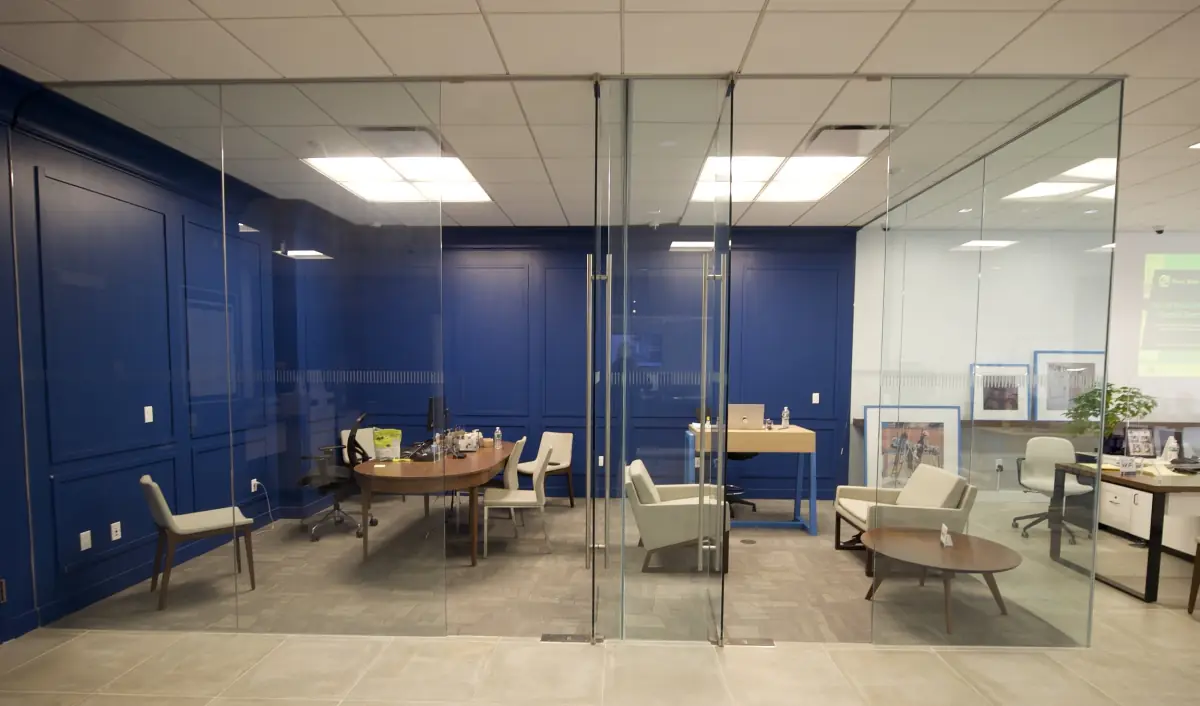 Frameless glass conference rooms in a Ponce Bank branch