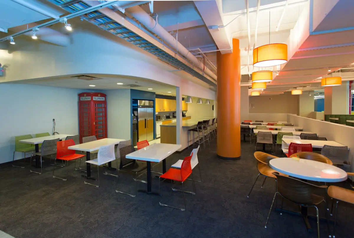 Taboola café with orange columns and pendant lights